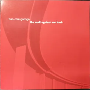 The wall against our back